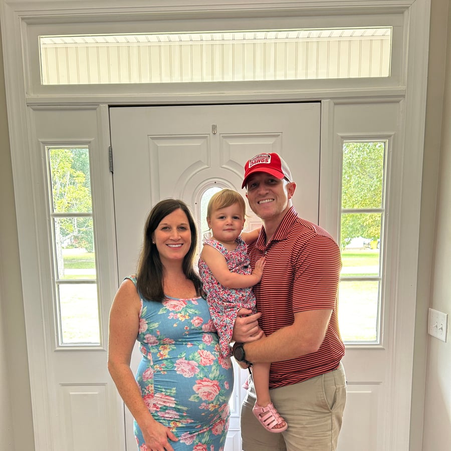 Dr. Nicole McDonald with her family at their front door in Bremen, Georgia